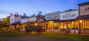a wagon and store fronts in the old west style
