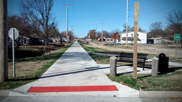 a paved trail through iola