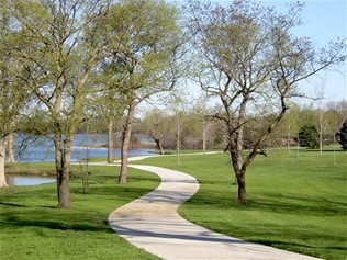 paved path by a lake