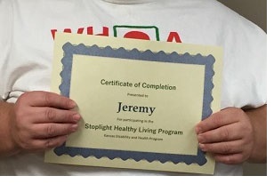 Jeremy shows off his certificate